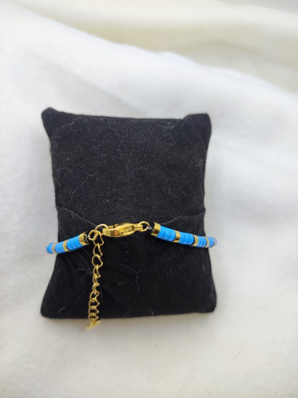 Bracelet avec perles bleu et doré