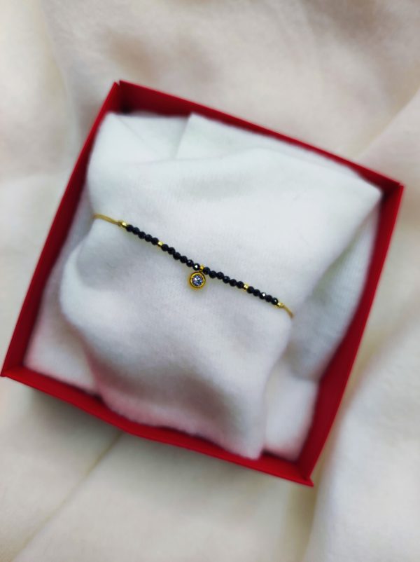 Bracelet perles noires et strass